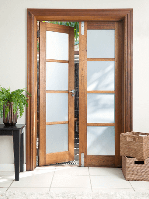 French door with removable frosted window film applied